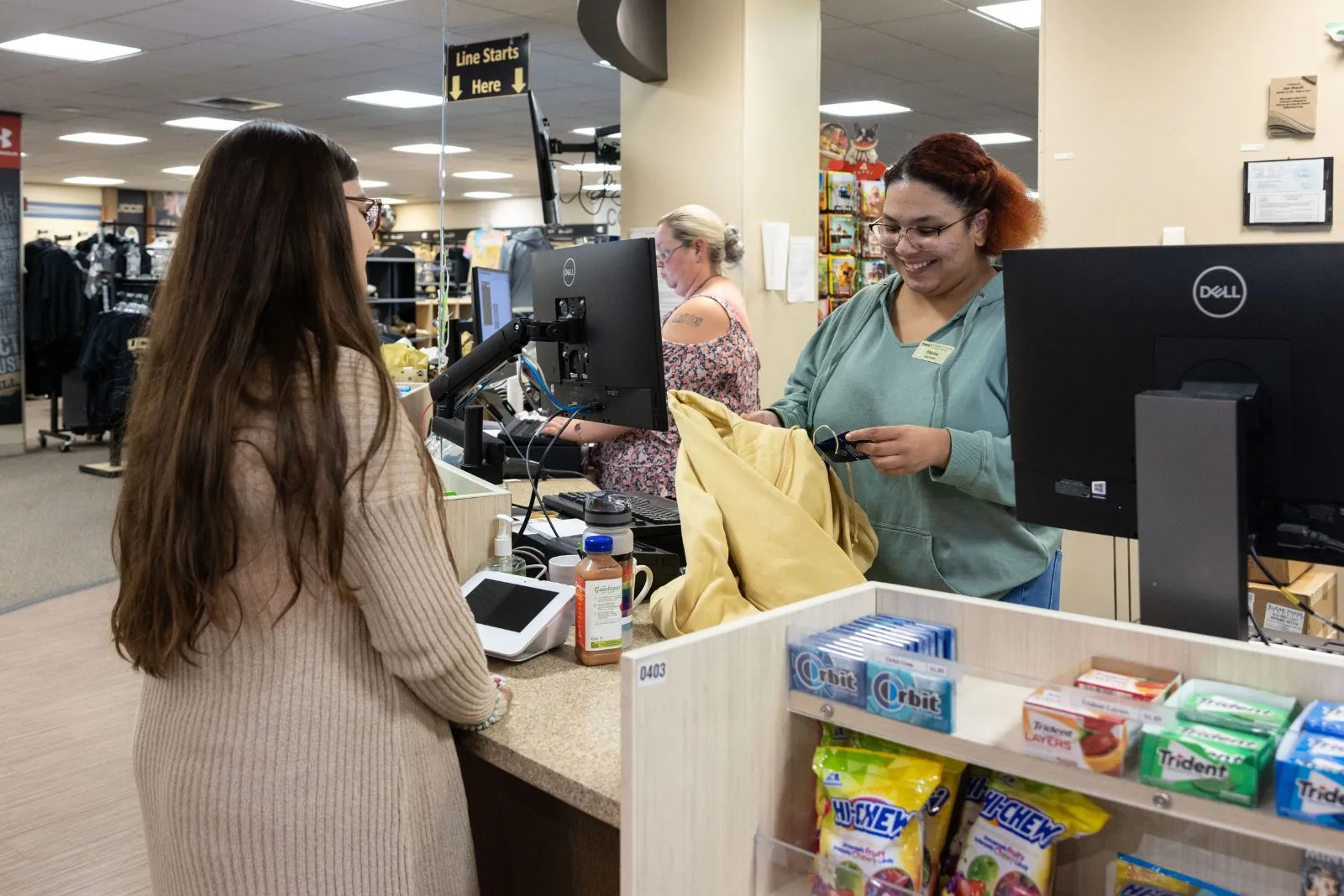 student checking out at the campus store